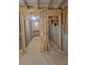 Unfinished basement featuring concrete walls, exposed beams, and room for customization, with lighting at 558 Fairview Oak Place, Dallas, GA 30157