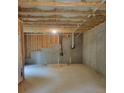 Unfinished basement with concrete walls, exposed ceiling, and stubbed plumbing for future development at 558 Fairview Oak Place, Dallas, GA 30157