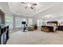 Spacious main bedroom suite with tray ceiling, sitting area, and large windows allowing lots of light at 2823 Seagrave Way, Marietta, GA 30066