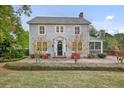 Charming two-story home with gray shingle siding, manicured landscaping and covered porch at 452 Cherokee Ne St, Marietta, GA 30060