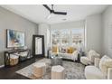 Bright living room with large windows, stylish furniture, and contemporary decor at 6442 Canopy Dr, Sandy Springs, GA 30328