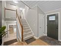 Inviting foyer showcasing hardwood floors, staircase, and natural light at 2310 Piedmont Forest Dr, Marietta, GA 30062