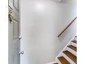 Welcoming entryway with wood stairs and railing, offering a glimpse of the home's interior at 2901 Ne Lenox Rd # 305, Atlanta, GA 30324