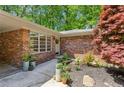 Inviting brick facade with a stylish front door, decorative plants, and a well-maintained walkway at 2029 Dover Hill Ne Pl, Atlanta, GA 30345