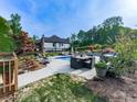 Inviting backyard pool and patio area, perfect for outdoor relaxation and entertaining at 1076 Pinyan Ln, Canton, GA 30115
