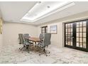 Modern conference room with sleek gray chairs, wooden table, and stylish marble flooring at 2870 Pharr Court S Nw # 1608, Atlanta, GA 30305