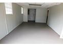 Spacious basement area with painted walls and a neutral-colored floor, offering a versatile space at 464 Mephisto Cir, Lawrenceville, GA 30046