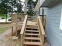 Exterior staircase leads to wooden deck with railings at 464 Mephisto Cir, Lawrenceville, GA 30046