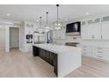 Spacious kitchen featuring an oversized island, stainless appliances, and custom cabinetry at 2728 Talley Ln, Buford, GA 30519