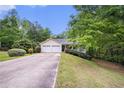 Inviting ranch-style home with a two-car garage and charming front porch at 140 Laney Ct, Mcdonough, GA 30252