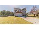 Well-maintained two-story home with a lush lawn and a classic suburban aesthetic at 1542 Armende Cir, Dacula, GA 30019
