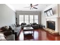 Bright living room featuring hardwood floors, a fireplace, and large windows at 2248 Fort Se Dr, Smyrna, GA 30080