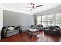 Cozy living room with ample seating, hardwood floors, and natural light at 2248 Fort Se Dr, Smyrna, GA 30080