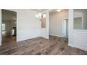 Dining room with hardwood floors and classic wainscoting detail at 267 Eason Ave, Bowdon, GA 30108