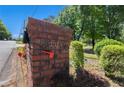 Close up of brick mailbox with house number and a small red flag at 2405 Old Salem Se Rd, Conyers, GA 30013