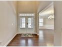 Elegant foyer featuring a high ceiling, hardwood floors, and a direct view into the dining area at 4395 Wildbrooke Pkwy, Cumming, GA 30041