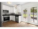 Charming kitchen with stainless steel appliances and direct access to the backyard patio at 1211 Argonne Ne Way, Atlanta, GA 30324