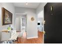 Inviting entryway with hardwood floors, soft gray walls, and view of living space at 1705 Monroe Ne Dr # D01, Atlanta, GA 30324