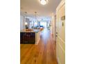 Open-concept entryway boasting natural light, hardwood floors, and flows seamlessly into the kitchen and living area at 200 River Vista Dr # 236, Atlanta, GA 30339