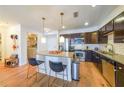 Well-equipped kitchen featuring stainless steel appliances, granite countertops, subway tile backsplash, and an island with seating at 200 River Vista Dr # 236, Atlanta, GA 30339