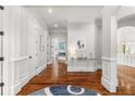 Inviting foyer with gleaming hardwood floors and an open view to living spaces at 3215 Oxleas Ct, Cumming, GA 30041