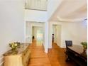 Bright foyer with hardwood floors, a high ceiling, and a view into adjoining rooms at 365 Friars Head Dr, Suwanee, GA 30024
