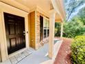 Charming front entrance featuring a black door, stone accents, and a welcoming porch at 365 Friars Head Dr, Suwanee, GA 30024