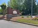 Parks of Stonecrest community sign with lush landscaping and beautiful trees at 3536 Dogwood Pass, Stonecrest, GA 30038