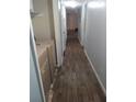 Hallway featuring wood floors, gray walls, and bright overhead lighting at 1316 Camelot Dr, College Park, GA 30349