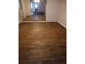 Spacious living room featuring wood floors and a decorative mirror at 1316 Camelot Dr, College Park, GA 30349
