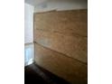 View of an incomplete plywood wall, showcasing an unfinished renovation project inside the property's framework and layout at 1316 Camelot Dr, College Park, GA 30349
