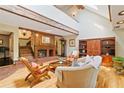 Bright living room featuring a vaulted ceiling, fireplace and hardwood floors at 4820 Coppedge Trl, Peachtree Corners, GA 30096