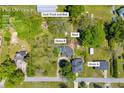 Aerial view of a 1-acre lot with two homes, a shed, and space for a junk truck and boat in Loganville, GA at 215 Fair St, Loganville, GA 30052