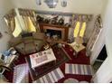Features a fireplace, patterned rugs and heavy drapes. The space shows some signs of wear and clutter at 5001 Panola Mill Dr, Lithonia, GA 30038