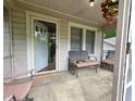 Inviting front porch offering a relaxing outdoor space with seating and a 'WELCOME' doormat at 502 S Evelyn Nw Pl, Atlanta, GA 30318