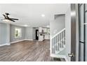 Bright open-concept living space with hard surface floors and gray walls at 3031 San Jose Dr, Decatur, GA 30032