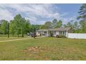 Spacious front yard showcasing the home's facade, landscaping, and inviting curb appeal at 5185 Twin Oak Ne Dr, Woodstock, GA 30188