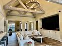 Bright living room with vaulted ceilings, wood beams, and modern furnishings at 216 Slate Dr, Buford, GA 30518