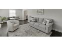 Inviting living room features hardwood floors and stylish neutral furniture at 2982 Ringle Rd, Brookhaven, GA 30341