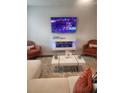 Cozy living room with a modern fireplace, plush seating and television at 4829 Station Lane -Lot 30, Union City, GA 30349