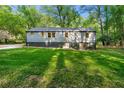 Charming two-story home with well-maintained lawn and mature trees providing ample shade at 1186 Thomas Rd, Decatur, GA 30030