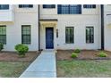 Attractive townhome showcasing a welcoming entryway, well-manicured landscaping, and a modern design at 3677 Sorrel Ln, Duluth, GA 30096