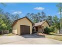 Well-maintained ranch-style home featuring a charming facade, attached garage, and green lawn at 8083 Cypress Ct, Villa Rica, GA 30180