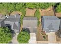 A birds-eye view shows the house's location between neighboring homes and lush greenery at 3610 Darcy Ct, Kennesaw, GA 30144