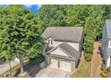 An aerial perspective reveals the home's well-maintained roof and landscaping, with mature trees on the property at 3610 Darcy Ct, Kennesaw, GA 30144