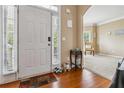Bright foyer with hardwood floors, leading to a cozy living space at 3215 Rose Petal Ln, Powder Springs, GA 30127
