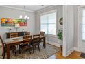 Dining room featuring a modern chandelier and large windows at 1976 Boyd Trace Nw Ln, Atlanta, GA 30318