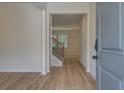 Entryway showcases beautiful flooring leading to the staircase with decorative railings at 1129 Georgian Point Dr, Lawrenceville, GA 30045