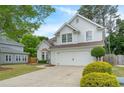 Charming two-story stucco home featuring a two-car garage and pristine landscaping at 2263 Seatton Ct, Marietta, GA 30062