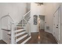 Bright foyer with wood floors and a staircase at 2263 Seatton Ct, Marietta, GA 30062